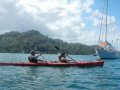 portobelo paddling alongside ships